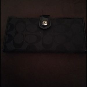 Black thin Coach wallet.